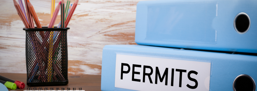 A binder of permits that LSM helped a customer get for their new Lennox furnace